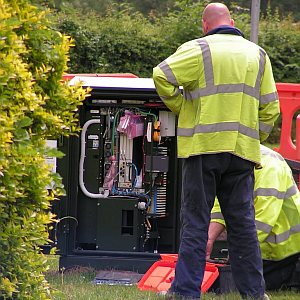 Openreach engineers working at an FTTC cabinet