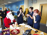 Great care is taken over the judging of the Timico mince pie competition  with Santa looking on