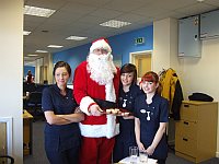 The judges line up for a cuddle with Santa and to tell him what they would like for Christmas