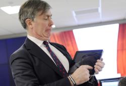Patrick Mercer MP  swipes iPad to open virtual curtains officially opening the Timico datacentre