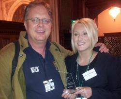 Trefor Davies and Timico VoIP Product Manager Gemma Jankiewicz show off the ITSPA Award for Best ITSP (Enterprise)