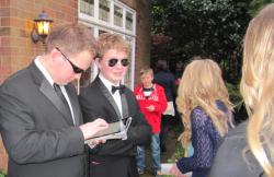 Hard men manning the door - street urchin hovering in background hoping to catch sight of some A-Listers