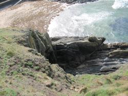 rocks at Fenella Beach seen from the base of Peel Castle