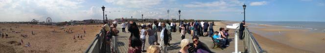 A panoramic view from Skegness pier on a hot and busy day in August