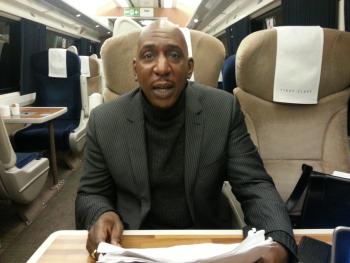 Colin McFarlane speaks his lines to Trefor Davies on the train to London
