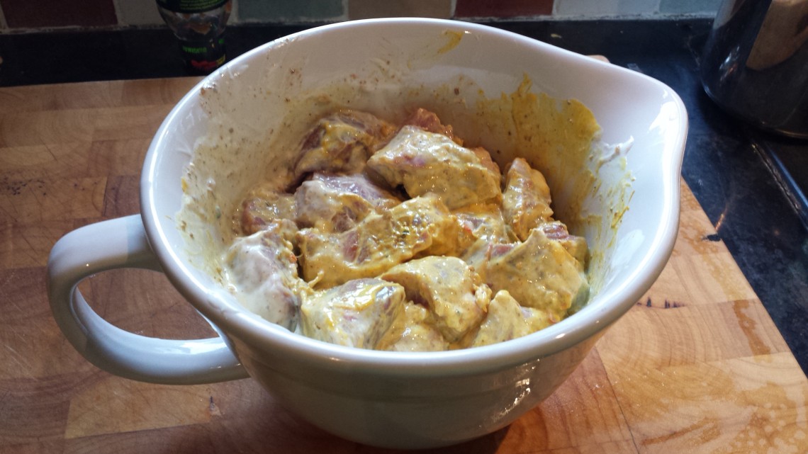 tandoori marinade lamb marinating in a jug