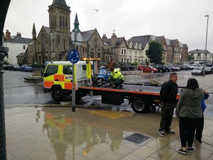 broken scooter in llandudno rain