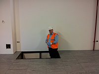 Trefor Davies stood next to the raised floor of a data center hall