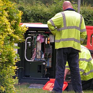 Openreach broadband engineers working at an FTTC cabinet