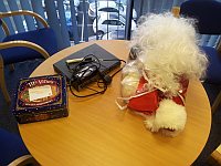 hmm, whats this, a tin containing mince pies, a Santa outfit and a Cisco router on someone's desk!