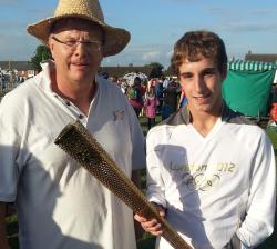 tref with Olympic torch in Lincoln