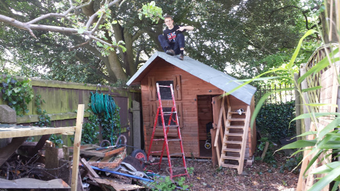 kid3 on top of shed