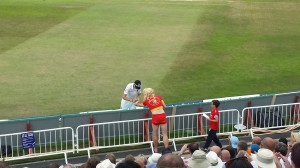 fielder gives Pamela Anderson his autograph at Trent Bridge